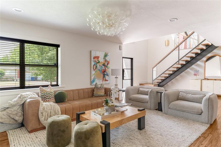 Located in the heart of Midway Hollow, this extensively renovated and thoughtfully expanded modern transitional home offers a seamless blend of elevated design, functional living, and meaningful upgrades. With over $500,000 invested, every detail has been intentionally curated to deliver both refined style and long-term livability. Natural light fills the open-concept floor plan, where rich hardwood floors and expansive living spaces create a warm and inviting setting. The chef’s kitchen serves as the heart of the home, featuring high-end appliances, a commercial-style range with statement vent hood, designer backsplash, updated hardware, and a custom bar area with bold wallpaper, perfect for gathering.
The main living area is anchored by a built-in media wall and sleek electric fireplace, complemented by visual comfort light fixtures, sconces and designer finishes throughout. The first floor offers exceptional flexibility with two guest bedrooms, each with a full bath, one currently styled as a dedicated office with custom built-ins and tailored window treatments.

Upstairs, the oversized primary suite offers a private retreat with a sitting area and a fully renovated spa-inspired bath featuring marble tile, designer finishes, elevated fixtures, and a generous walk-in closet. A substantial expansion adds two additional bedrooms, two bathrooms, walk-in closets, a secondary utility space, and multiple living areas.

Recent improvements include a new roof, additional HVAC system, and tankless water heater all completed in 2025, along with extensive cosmetic updates throughout.

The outdoor space features a heated pool, retractable awning with integrated heaters, refreshed landscaping, and custom wood planters, creating a private setting for year-round enjoyment.

Ideally located near the Dallas North Tollway and premier private schools, this home offers turnkey living in one of Dallas’ most desirable neighborhoods.