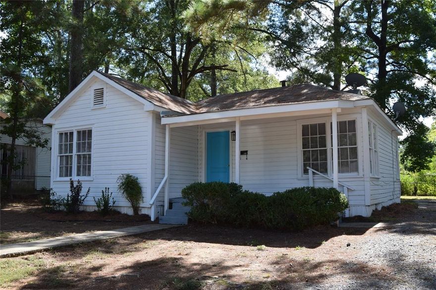 This would make a cute little starter home for a young couple or a great house for an older couple wanting something with less maintenance . 
It would also be a good rental property! The Living Room is a nice size with pretty laminate flooring and gray walls with white trim. The Kitchen is decent size with stove and refrigerator(AS-IS)There is also a place to hook up the washer and dryer in kitchen. The two bedrooms are also a decent size and a hall bath with tub shower combo. It has a large back yard with nice shade trees. Please call to see this move in ready home!