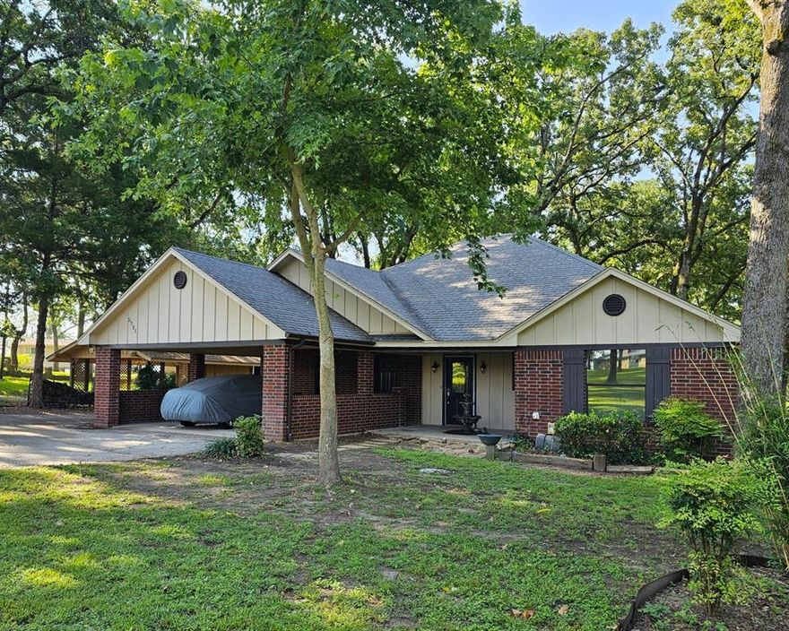 Quaint waterfront custom built home with split bedroom plan, large kitchen with attached dining room area; DR is open to the living room which has a WBFP, built-in cabinetry and lake views. Master BR has built-ins, a view of the lake, and en-suite bathroom. Nice lake view from the expansive rear porch.  Cape Tranquility has a waterfront community park with pavillion, which may be leased by residents for gatherings, a boat ramp, two docks. Roads repaved 2 or 3 years ago. Two large utility closets off of the two-car carport, with additional parking beside the driveway.  Irrigation via lake pump.  Upper Neches leased land that goes with the home is approximately 80' x 230' or just under a half-acre, as shown on Survey; the lease for Upper Neches land plus irrigation pump is about $100 per yr.