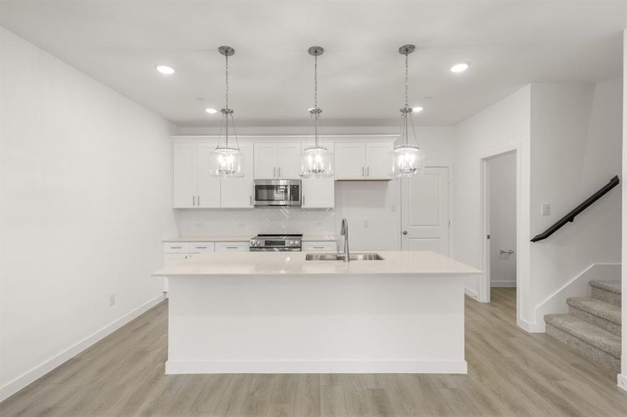 MLS# 21196665 - Built by Ashton Woods Homes - Ready Now! ~ Welcome to the Tulane, a thoughtfully designed two-story townhome in Watauga, TX. Designed with the Timeless Collection, this home features crisp whites and soft neutrals. Nine-foot ceilings enhance the openness, while a welcoming foyer, additional storage, and a two-car garage add practical convenience. The first floor is the heart of everyday living, featuring a bright, open-concept layout with a modern kitchen centered around a spacious island, shaker-style cabinetry, tile backsplash, and ample countertop space. The kitchen flows seamlessly into the dining and family areas, creating an inviting environment perfect for hosting or daily routines. Upstairs, two secondary bedrooms share a full bathroom, offering an ideal setup for family, guests, or a dedicated workspace. A versatile loft provides even more flexibility, whether as a media nook, play area, or home office. The private primary suite completes the second floor with a generous walk-in closet, double sink vanity, and a glass-enclosed walk-in shower. With its thoughtful use of space, elevated finishes, and flexible living areas, the Tulane delivers the modern comfort and refined style that define Ashton Woods living.