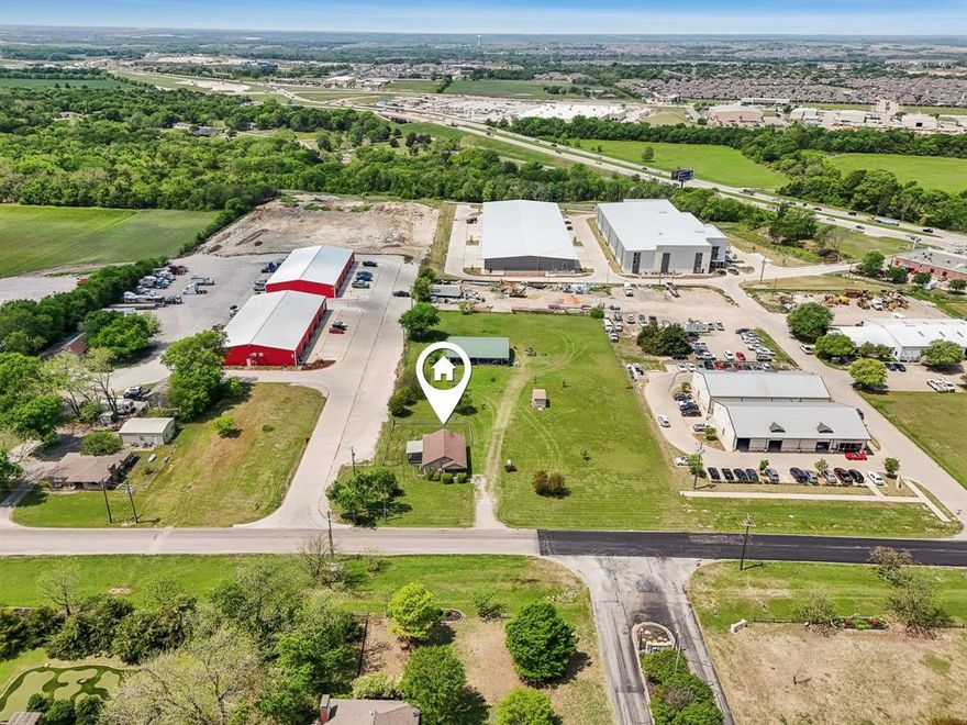 Unique two-parcel opportunity with residential structures and future commercial potential, located just one block from Hwy 121. Combined total of 2 acres with approximately 417 feet of frontage on Miller Road—a street already home to multiple local businesses and light industrial operations. The front 1.15-acre parcel sits within the City of Melissa and includes a tenant-occupied home, plus a 30x60 workshop with a bedroom, bathroom, and kitchenette—a mini barndominium, if you will. The rear 0.85-acre parcel lies outside the city taxing district and may offer greater flexibility for future use. City water, electricity, propane, and septic are in place. Currently zoned residential per Collin CAD, but identified in the City of Melissa’s Future Land Use Plan for future commercial (buyer to verify). Buyer and buyer’s agent should independently verify all zoning, land use, utility access, and development potential with the City and County. Just 5 minutes to the new HEB, Walmart Supercenter, and Buc-ee’s—placing you in the heart of Melissa’s explosive growth zone. Home. Shop. Investment. All just one block from 121. Or, literally, work from home.