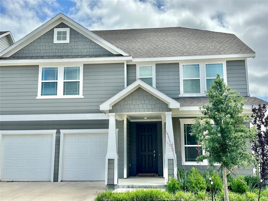 Beautiful craftsman-style home in Liberty at Providence Village with welcoming COVERED FRONT PORCH. 4 Bedrooms, 3.5 Baths, office and gameroom. Open floorplan with a soaring 20' CEILING in the living room area with large wall of windows overlooking backyard. Neutral WOOD-PLANK TILE flooring in the main living areas downstairs. 9' ceilings throughout first floor. Kitchen features painted gray cabinetry, quartz countertops with herringbone subway tile backsplash and stainless steel appliances. The Primary Bedroom is downstairs with an oversized walk-in closet along with double sinks, built-in drawers plus separate tub and shower in the bathroom. Upstairs there are two bedrooms that share a jack-and-jill bath and another bedroom that has its own full bath. Gameroom loft space offers plenty of flexibility of use. Abundant storage space - EVERY BEDROOM HAS A WALK-IN CLOSET! Large office is downstairs just inside the entry and features french doors along with its own closet. Covered patio in backyard. Full sprinkler system. Splash pad and playgrounds in the neighborhood. Located near recently opened Sprouts with Super Target and Kroger coming soon along with plans for restaurants such as Chili's, Bread Winners, Cafe and more!