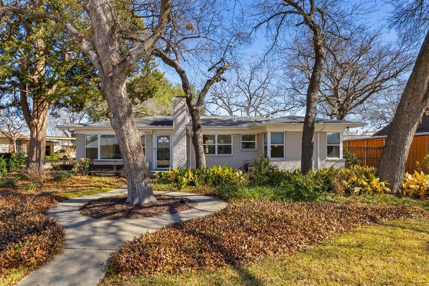 Welcome home to 9958 Galway Dr. This beautifully updated 3 bedroom 3 bath home is nestled on an oversized interior lot with .304 of an acre and  stunning drive up appeal. Located in East Dallas' Lake Park Estates, this charming home will not disappoint. Refinished hardwood floors greet you upon entry. Light and bright open floorplan with large living area featuring a huge picture window that brings all the natural light indoors. Updated kitchen with custom cabinetry, granite countertops and stainless appliances. Dining area with custom built ins and a wood burning fireplace. Retire to the cozy primary bedroom with ship lap walls and a luxurious ensuite bath. Both secondary bedrooms are generous in size, one also with an ensuite bath. Backyard oasis with deck, towering trees, separate garden area and a relaxing fire pit.  Oversized 2 car carport and a separate detached structure with heat and air perfect for a home office.  Brand-new award-winning Hexter Elementary. Convenient walk to local trendy restaurants, coffee shops and shopping.  Easy access to White Rock Lake and the area's superior hike and bike trails.