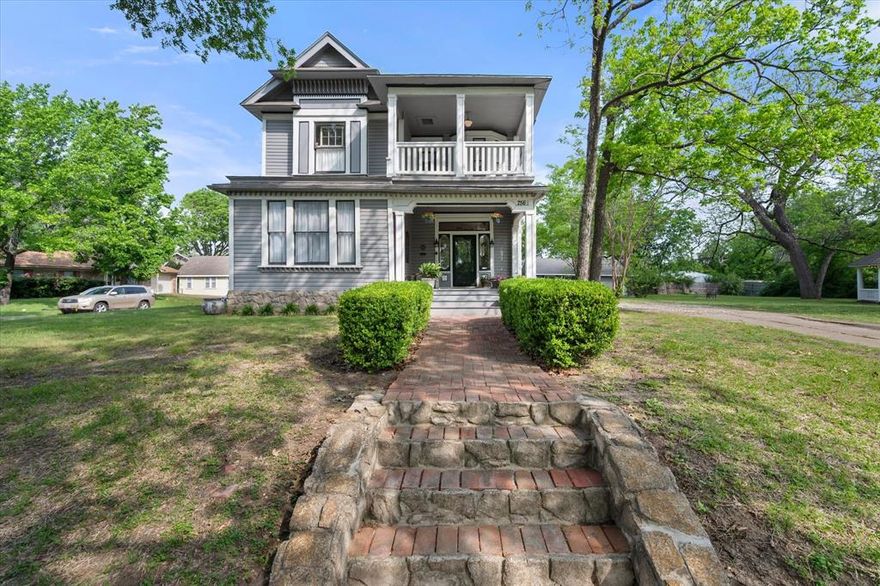 Charming 1903 Victorian home located in the Historic District of Corsicana.  Meticulously remodeled, offering 2,968 sq ft of elegant living space with 4 bedrooms, 2 and a half bathrooms boasting soaring 12-foot ceilings, gleaming hardwood floors, and modern sophistication. The gourmet kitchen features granite countertops and see through glass accented cabinets doors.  This home is complemented by a spacious office which could be a 5th bedroom, full-size laundry room, and inviting covered patios upstairs and downstairs. Set on over half an acre across two lots with the second lot having a beautiful gazebo for additional relaxing space.  There is MORE!!!  With all of this the property also includes a stunning in-ground pool with a pool house or guest house, perfect for entertaining or serene relaxation. A timeless blend of historic charm and contemporary luxury.