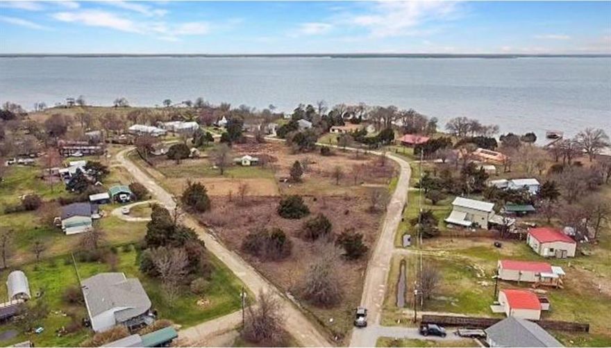 Dreaming of living within walking distance of the lake? Here it is, come build your dream home here on this corner lot a little less than half an acre. Located outside city limits. Cornet Lot next to it is also available.