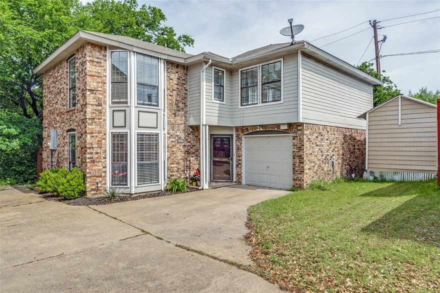 Updated 3-bedroom, 2.5-bath home located in the Pebblebrook community of Dallas, featuring a spacious family room with a wood-burning fireplace and an open layout ideal for everyday living and entertaining. The interior offers neutral tones and wood-like flooring in key areas, creating a clean and inviting feel. The flexible floor plan includes two generously sized secondary bedrooms along with an additional bedroom that can function as a home office, guest room, or bonus space. The upstairs primary suite includes a full bath and ample closet space. The backyard is a standout feature, backing to a peaceful creek with mature trees that provide added privacy and a natural setting, offering space to relax, entertain, or personalize with low-maintenance upkeep and scenic views not commonly found at this price point. Additional features include an oversized one-car garage and convenient access to I-635, all within the established Pebblebrook community with no HOA, which could be a great investment for rental.