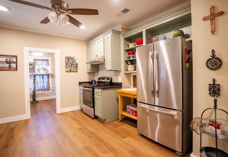 Check out this beautifully recently remodeled pier and beam home offering over 2,300 sq ft with 3 bedrooms and 2 bathrooms. Thoughtfully renovated with intention and quality craftsmanship, this one-of-a-kind home blends historic character with modern updates and long lasting materials. This truly is a rare opportunity to own a home that has been meticulously renovated with each upgrade completely intentional with long-term quality in mind. 

The gorgeous dining room is filled with natural light creating a bright yet cozy atmosphere with a charming dutch door adding character and flexibility. 

The kitchen features custom cabinetry, granite countertops as well as other modern appliances and fixtures. The entryway into the kitchen has been enlarged to add to the spacious flow. New appliances installed in 2025 include oven (never used), stovetop (used very few times), vent hood and washer and dryer (lightly used). 

Electrical upgrades include new outlets and plugs throughout the home plus newly installed thermostat completed end of 2025. There is luxury vinyl plank flooring located throughout the home complimenting the reclaimed crown molding and two fireplaces.Both bathrooms have been updated with new cabinets, granite and other finishes. 

The primary bedroom offers a private retreat within the home including a spacious walk-in closet, fireplace, split unit for added comfort and access to closed-in side patio and private outdoor sitting area. 

The laundry room provides built-in storage original to the home with an added larger shelf. Enjoy plenty of sitting area on wooden front porch with covered entry with both wooden steps and wheelchair accessible ramp adjacent to the two-car carport, driveway and storage building as well as secluded sitting area with covered side patio. New roof installed in December, 2024.

May be eligible for USDA 100% financing for qualified buyers subject to approval.