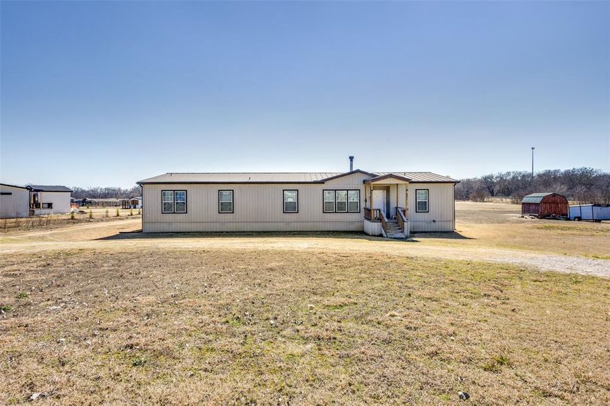 Nestled on 3.28 beautiful acres, this spacious double-wide mobile home offers the perfect blend of comfort, flexibility, and opportunity. Priced under market value, this property is an incredible find for anyone seeking room to grow—both inside and out.

Step inside to discover a thoughtfully designed 2,200 sq ft. layout featuring 4 generous bedrooms and 3 full bathrooms, providing plenty of space for family and guests. The welcoming main living room is perfect for gathering and relaxing, while a dedicated home office creates an ideal work-from-home setup. In addition, a versatile bonus space offers endless possibilities—use it as a second office, additional living area, playroom, or hobby room to fit your needs.

Outside, the 3.28 unrestricted acres give you the freedom to truly make this property your own. No restrictions. 

If you’ve been searching for acreage, flexibility, and value all in one, this charming property is ready to welcome you home. 

Please contact listing agent for any showings, or questions.
