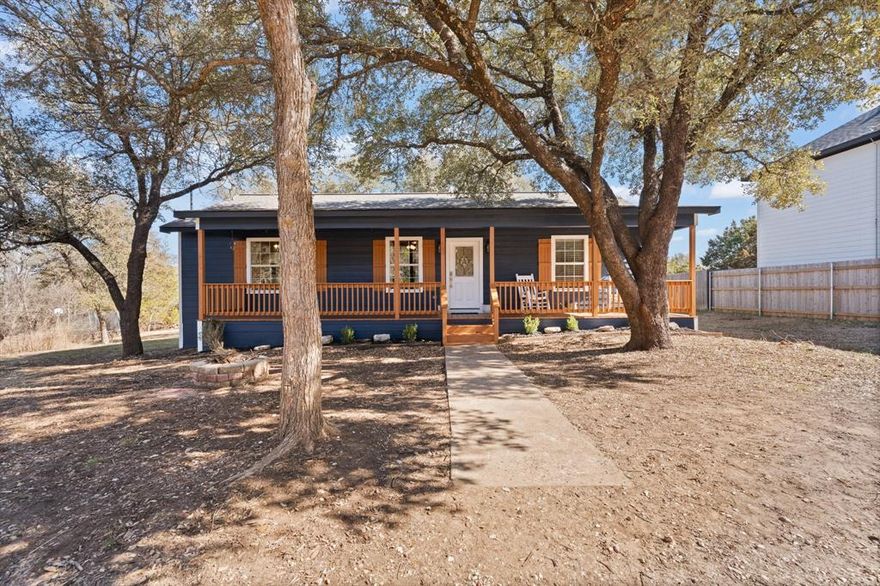 Welcome to this delightful country home, nestled among mature trees on over half an acre.  Located in the Fisherman’s Paradise Community that overlooks Hamm Creek Park, this home is close to the Brazos River offering fishing, boating, and camping.  Venture through the stone gated entrance to discover the charm of this adorable home.  The home features 3 bedrooms, 2 bathrooms, and a desirable split floor plan. Enjoy peaceful mornings and relaxing evenings on the covered front porch or the private, expansive back porch, perfect for coffee, barbecues, and plenty of space for kids to explore. Situated on 0.6 acres, the property offers shade trees and ample room for gardening and outdoor activities. This well-maintained home is move-in ready with numerous updates, including cedar fencing, gated entrance, flooring, interior and exterior paint, doors, large back deck, a new roof to be installed and more.  Claim your very own country cottage retreat! Showings starting Sunday, Feb 8.