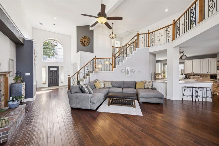 From the moment you step inside, you’ll fall in love with this spacious and thoughtfully designed 5 bedroom 4 bath home, featuring soaring ceilings, and an abundance of natural light. The open floor plan flows beautifully with wood floors throughout the entry, main living room, and chef’s kitchen. To the left of the entry is a versatile double room that provides endless possibilities to make this house truly feel like home, it's perfect as a formal living and dining space, dual offices, or a playroom. Two bedrooms and two full bathrooms are located downstairs, ideal for guests or multigenerational living. The oversized primary suite is tucked away at the back of the home with serene views of the pool and private backyard. Enjoy direct access to the patio, along with a spa-like bathroom with a huge walk-in shower, split vanities, and walk-in closet. The gourmet kitchen features stainless steel appliances, a downdraft cooktop vent in the island, a large stainless steel sink, and a pantry with space for all your Sam’s or Costco trips! The kitchen also includes a built-in desk or office nook that’s convenient for a home computer, managing household tasks, or helping with homework while dinner is on the stove. It opens effortlessly to the everyday dining area and expansive living room, featuring a stunning wall of windows and cozy fireplace. Upstairs, are three additional bedrooms; one with its own ensuite bath, while the other two share a full bathroom with dual sinks. A massive media or game room offers flexible space for movie nights, gaming, or gathering with loved ones. Outside is your own private oasis with a peaceful backyard that includes a sparkling pool, lush landscaping, and plenty of privacy for sunbathing, entertaining, or letting the kids swim in peace. There's even extra parking in the back for an RV, boat, trailer, or additional vehicles. This home truly has it all with space, function, luxury, and a location that puts you right in the heart of McKinney!