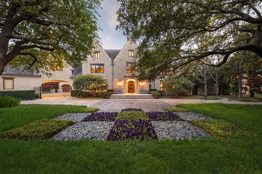 Welcome to 5432 Falls Road, nestled on a corner lot spanning 1.04 acres in Old Preston Hollow. Designed by Robbie Fusch & built by Steve McLure in 2004, this estate is perfect for luxurious living & entertaining. The estate has been meticulously maintained & updated from 2021 to 2023, including a new water filtration system, new ACs, a new hot water tank, new windows, and a new sump pump. With 5 beds & 7 baths, including dual primary baths in the primary suite, this home offers space & comfort. Step into the gourmet kitchen, complete with a working scullery & a large wet bar, perfect for entertaining guests. The home features a 3-story cathedral ceiling, stunning staircases, & gorgeous millwork throughout, adding grandeur & sophistication to the living spaces. Enjoy the convenience of an office both downstairs & upstairs, along with a gym for your fitness needs. The property also includes a 3-car garage & a gated motor court, adorned with mature trees that enhance its natural beauty.