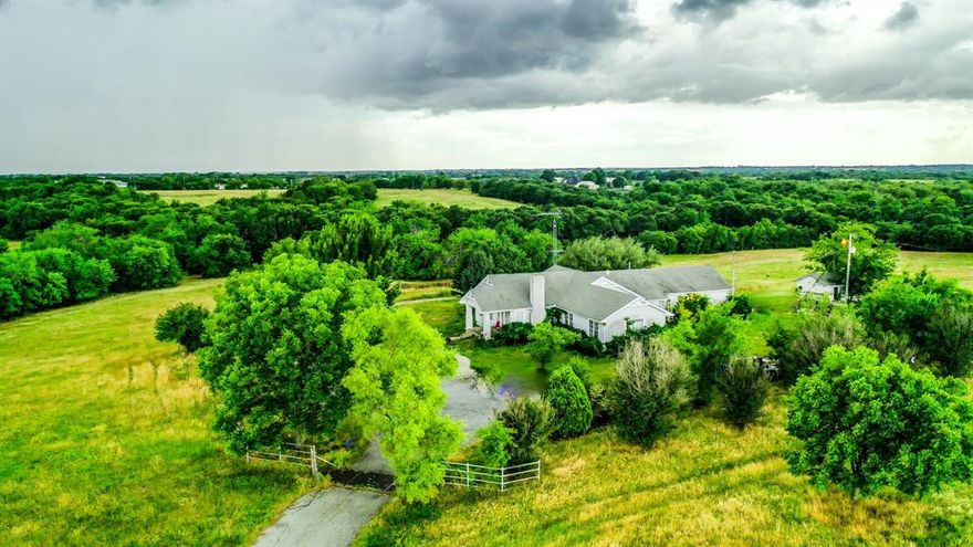 Nature lover's dream property! This property has it all: trees, open pastures, ponds, creekbed, elevation change and wildlife galore! Located only three miles from The Hagerman Refuge, ten minutes from Lake Texoma and twenty minutes from Sherman. Come enjoy beautiful sunsets with views for miles. Also a hunter's paradise consisting of deer, waterfowl, hogs, bobcats and more! Perfect place for the family to enjoy all the peace and quiet the country life has to offer. Older farmhouse can be restored to past glory so you can enjoy peaceful moments on the front porch as you gaze across your slice of Texas heaven. 20x30 workshop with attached equipment shed. Many fabulous homesite options to add a second home or build your dream home. Property is ag exempt as well. Come see this magnificent property!