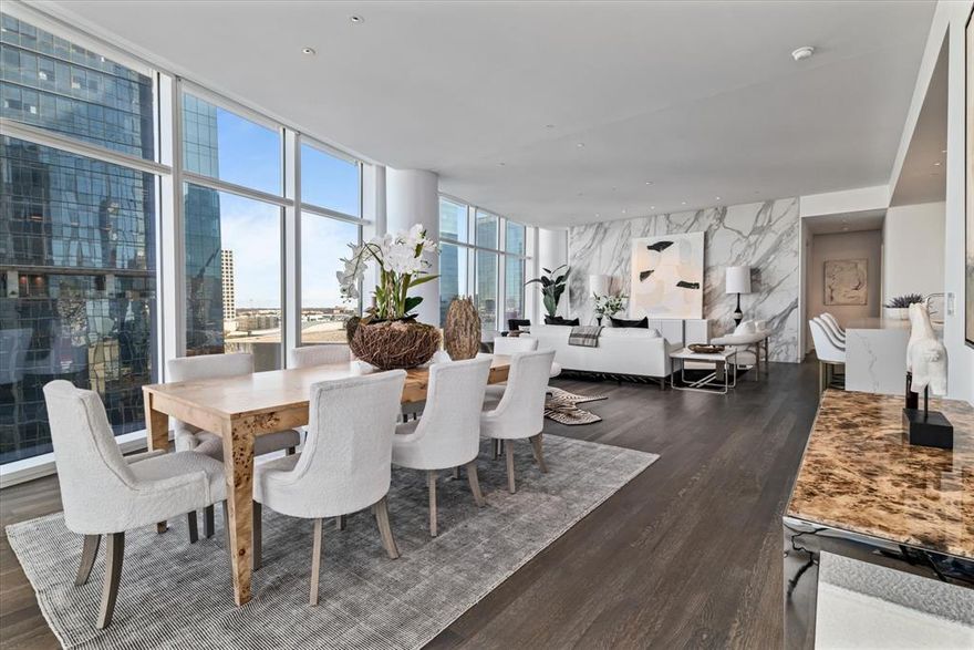 Welcome to the pinnacle of luxury living at Museum Tower, an architectural masterpiece designed by architect Scott Johnson. Located in the vibrant Dallas Arts District, this 2,407 sq. ft. residence, built in 2012, features two spacious bedrooms, two marble-clad bathrooms, and floor-to-ceiling windows offering panoramic views of Klyde Warren Park and the Dallas skyline. The gourmet kitchen boasts Miele appliances, a wine fridge, custom cabinetry, and a stunning quartz waterfall island. White oak floors and motorized blinds elevate the home's sophisticated ambiance, while a private terrace offers seamless indoor-outdoor living. Residents enjoy world-class amenities, including a resort-style pool, fitness center with sauna and steam rooms, elegant lounges, outdoor dining spaces, a private dog park, and more. Services such as 24-7 concierge, valet, house car, and curated resident events ensure an unparalleled lifestyle. Experience the timeless elegance and exceptional design of this Scott Johnson masterpiece—schedule your private tour today.