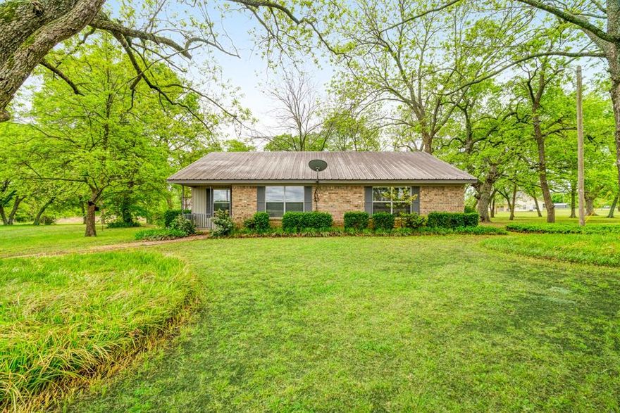 Tucked away on a little over 2 acres, this 2 bedroom, 2 bath home in Chisum ISD offers peaceful country living with plenty of room to spread out.  Inside, you'll find a spacious living area, a large kitchen with abundant cabinet and counter space and a layout that offers both comfort and functionality.  The home features generously sized room and great natural light throughout.  Outside, the property offers mature trees, open space and a 24x24 shop that is perfect for hobbies or a workspace.  With a covered area, room to roam and a convenient location, this property offers a great opportunity to enjoy quiet living just outside of town.