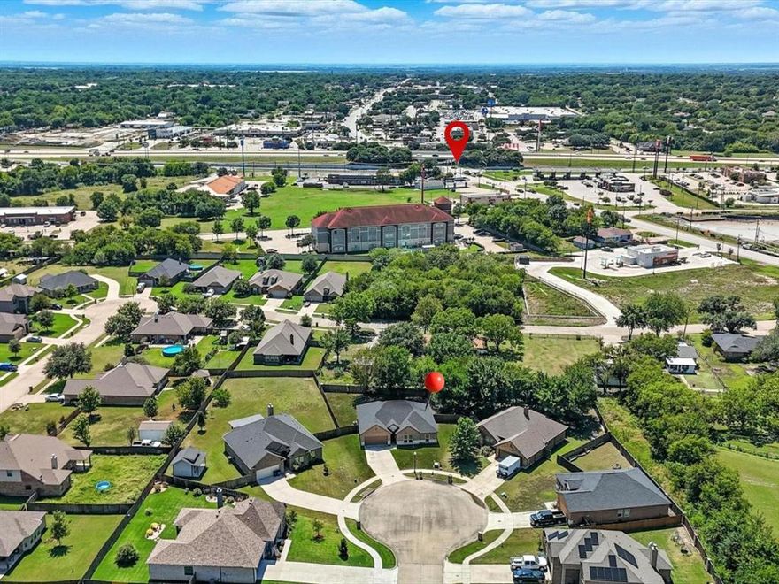 Meticulously maintained, single-story gem constructed in 2021. Located in the heart of the city, this property offers quiet living on an oversized 0.324-acre cul-de-sac lot in highly sought-after Promontory Point North, with no HOA. Features 4 bedrooms, 3 bathrooms, 2-car garage, and an expansive driveway, making additional parking a breeze. Inviting floor plan with the roomy half-bath conveniently located off the main living area, perfect for relaxed daily living and effortless entertaining. Fresh updates make this home truly move-in ready, complemented by abundant natural light throughout. The kitchen is a chef’s delight, thoughtfully designed for both everyday cooking and entertaining, ample counter space, walk-in pantry, and dine-in bar top seating; seamlessly flows into the dining and living spaces. The primary suite serves as a peaceful retreat with a private en-suite bath.  The generously sized secondary bedrooms offer flexibility for family members, guests, or a home office. Step outside to a backyard full of possibilities. There's plenty of room for a pool, garden, or customize your private outdoor oasis. Conveniently located near schools, shopping, and parks. Available properties in Promontory Point North are limited, this is a unique pocket of newer-built homes on oversized lots offering quick, 1–2 minute access to I-45. Opportunities like this are rare in this community, and it may be another year before the next listing becomes available. VA assumable loan available at 5% interest for qualified veteran buyers to benefit from the seller’s low-rate financing and reduced closing costs.