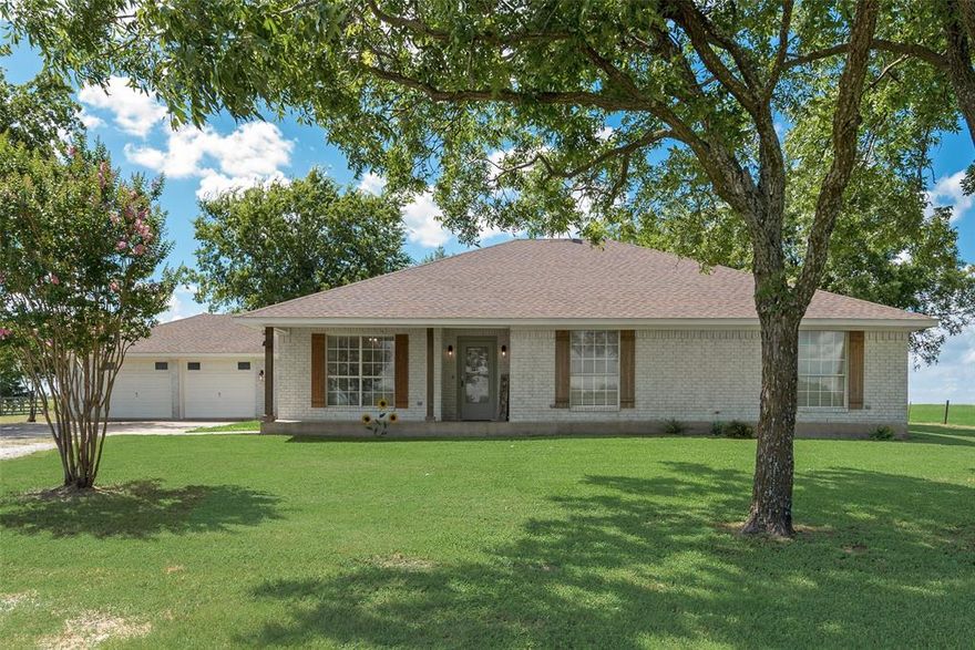 Peaceful Country Retreat on Just Over 3 Acres
Discover this beautifully updated 3-bedroom, 2.5-bath home set on a little over 3 acres in the county. Surrounded by mature trees and expansive skies, this property offers a perfect balance of seclusion and serenity.

Enjoy new flooring, fresh interior paint, and stylish updates throughout—including plumbing, light fixtures, and hardware. The kitchen features refreshed cabinet doors and drawers, along with brand-new appliances. A spacious two-car garage offers built-in cabinets for additional workspace, while a backyard storage shed provides the perfect spot for lawn tools and outdoor gear.

Whether you're seeking a quiet country getaway or a spacious setting to put down roots, this home offers modern comfort, natural beauty, and room to thrive. 
Don’t miss this opportunity to own a slice of the countryside with the comforts of an updated home.