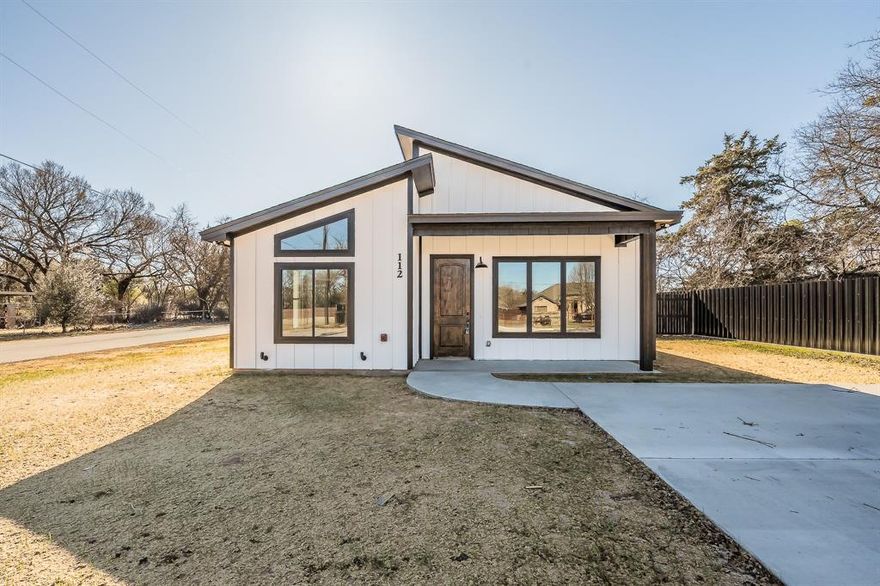 ***$5,000 towards buyers expenses***Welcome to this stunning newly constructed open design home. Built with high-efficiency materials and designed for minimal maintenance, this home features spray foam insulation and all tile floors. Inside, you’ll find vaulted ceilings throughout all 3 bedrooms, providing an open and airy feel. As soon as you walk in the 8’ tall wooded front door, you’ll be greeted by the beautiful fireplace. The kitchen features a large island with built in microwave, custom cabinetry, and black quartz countertops. The split bedroom layout offers privacy and space for everyone. The owner's suite includes a spacious master closet. The primary bath is designed for convenience and comfort with a large walk-in shower and bench. Enjoy the large covered back porch which is perfect for relaxing or entertaining. A perfect combination of modern design, functionality, and breathtaking views — come see it today!