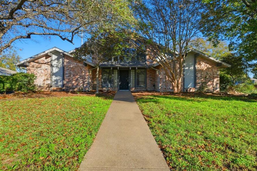 Charming home featuring 3 bedrooms and 2 bathrooms with inviting curb appeal. Step inside to a spacious living room with a cozy fireplace, crown molding, and high ceilings. The kitchen offers a breakfast bar, and a pantry for added storage. The primary suite includes a separate double vanity for convenience and style. Enjoy the beautiful atrium-style back porch with wood flooring and decorative landscaping—perfect for relaxing or entertaining. A 2-car attached garage completes this move-in-ready home blending comfort and character!