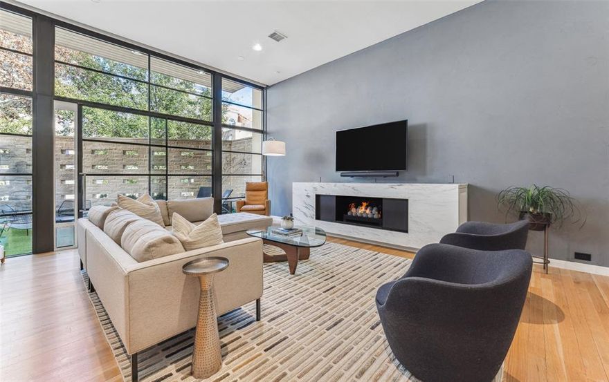 Stunning, modern SFA located in a quiet Oak Lawn neighborhood between Oak Lawn Ave. and Turtle Creek Blvd.  This two-story home offers a sleek, sophisticated design featuring an open floor plan bathed in natural light.  The first floor is complete with a spacious living area that opens to one of the three outdoor living spaces.  The chef's kitchen includes a spacious island, JennAir appliances, and walk-in pantry. The dining area is separate from the kitchen and overlooks the second outdoor living space.  A small office with built ins completes the first floor.  The second level primary suite features a tree shaded balcony and an expansive primary bath with walk in closet.   The second floor living area is currently used as the fitness room but can be used as a second living area or study.  Two bedrooms with ensuite baths and the laundry room completed the second floor.  Minutes to shopping, restaurants, the Katy Trail, Uptown, Downtown and the Arts District.