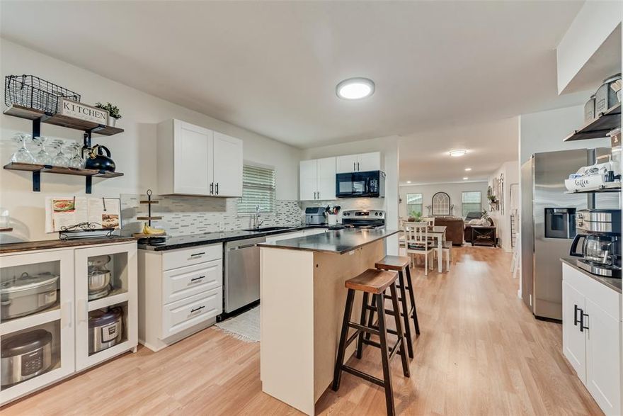 A modern sanctuary with urban velocity - step inside to leave the hustle of the city behind. This home has been masterfully reimagined with a Modern Farmhouse aesthetic, featuring an open-concept floor plan with natural light pouring in from the new windows. The chef-inspired kitchen serves as the home's centerpiece, boasting crisp white shaker cabinetry, an island with additional storage, and stylish designer fixtures. With three bedrooms, you'll have plenty of versatile space for guests or a dedicated home office.  
Ideally situated for maximum convenience directly adjacent to I-30, this home offers a rare 'best of both worlds' opportunity: the high energy and connectivity of city or campus living combined with the luxury of a private backyard and room to breathe. While you're just seconds from the ramp for a stress-free commute, the upgraded interior ensures you'll be welcomed home to a quiet oasis at the end of the day. 
Spend your mornings in your spacious yard and your evenings at Sundance Square or TCU, all without ever being more than 10 minutes from home. Whether you're looking for a stylish primary residence or a high-performing short-term rental near the heart of the city, this Ridglea-area gem delivers a high-end design at a price point that simply can't be beat.