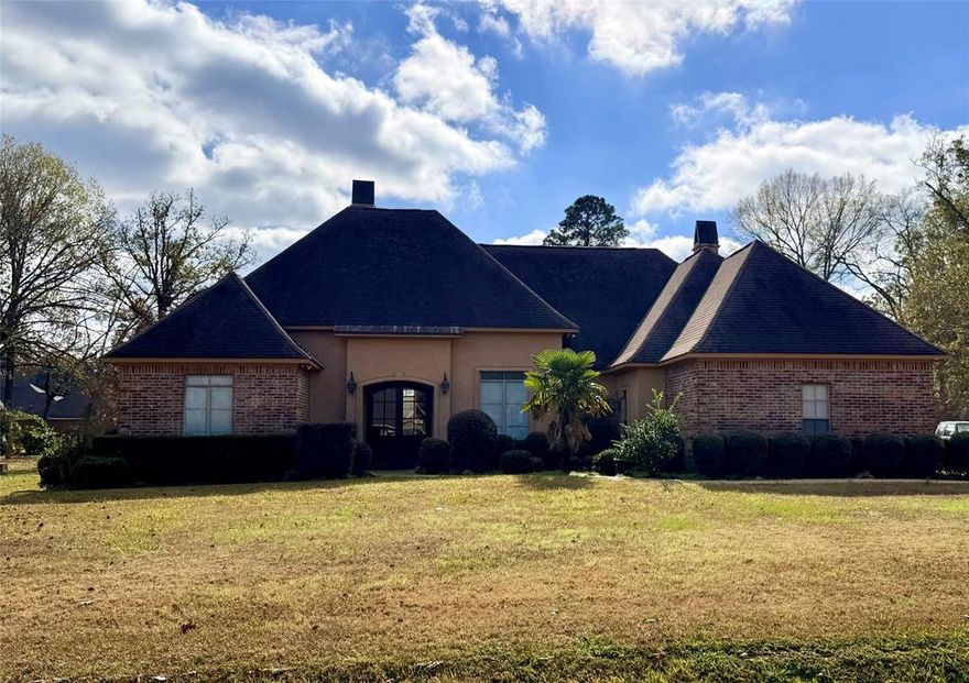 Located in the coveted Fountainbleau Estates in Keithville, this truly gorgeous home offers incredible space, character, and the opportunity to make it your own. Set on a beautiful 1-acre lot with mature landscaping, the home features two living areas and two dining areas, ideal for both everyday living and entertaining. The kitchen is well-appointed with built-in ovens, a 6-burner gas cooktop, a built-in refrigerator, and a charming hearth room with custom built-ins just off the kitchen. A separate living room showcases wood floors, a fireplace, and additional built-ins. Both secondary bedrooms offer the privacy of en suite bathrooms, while the spacious primary suite features a tray ceiling, a spa-style bath with a soaking tub, a stall shower, dual sinks, and a large walk-in closet. The seller is replacing the roof, and the price reflects the cosmetic updates needed, such as paint, windows, and the patio ceiling, making this an exceptional value in one of Keithville’s most desirable neighborhoods. This is a rare chance to own a beautiful home with strong bones and add your personal touch.