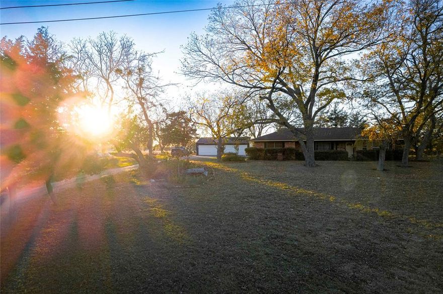 Home on 6.25 acres in Blue Ridge. This stunning property offers an incredible opportunity to own desirable land in Collin County. Accessed by County Road, this land provides the convenience of country living while being just minutes away from major highways, including Hwy 121 and the US 75 corridor. The location offers easy access to the nearby cities of Greenville, McKinney, Anna, Melissa, and Princeton. The property utilities include electric, water, and sewer. Current exemptions provide reduced taxes. With a lovely pecan tree grove adding natural beauty and charm, the land is both functional and scenic. At the front of this property sits a 1,964 sq ft ranch home and a 1,400 sq ft detached garage for extra storage or workshop space. Bring your vision to make this home your own with some TLC. The property is not in a floodplain, which adds to its usability. Located less than 30 minutes from Lake Lavon, this property offers the ideal balance of country tranquility and convenient access to nearby amenities.