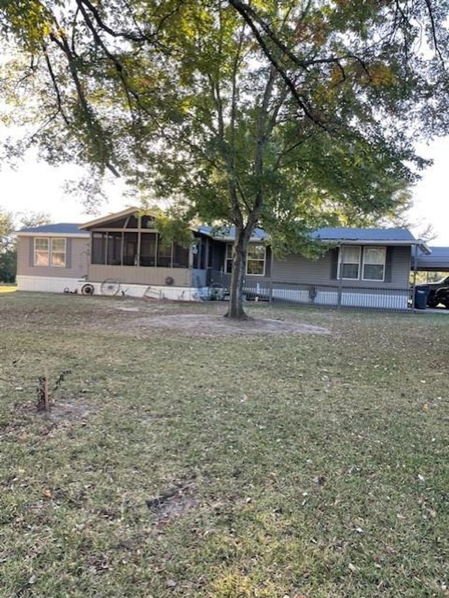 Single story manufactured home combined with land as real estate with 2 completed shops available with heat & air and 220 electrical and one with AC only to be useable for just about anything you would like to use them for. Located in a small community not far from renown bass fishing Lake Fork. Open floor plan with many remodeled upgrades to this 1936 Sq Ft home sitting on over a .5 acre.  Handicap Accessible features and large screened in porch for your enjoyment . Split bedroom plan and additional flex room for crafting or a possible 4th bedroom if needed . There is a regional UT hospital in Quitman downtown and shopping is available as well as being just a quick drive into Mineola, Sulphur Springs and not but about 1 hour into Tyler.  Bring your toys and projects and enjoy the quiet natural setting out by the lake.