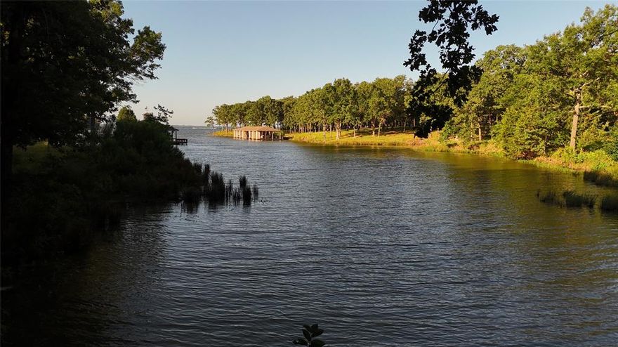 If you’ve been looking for a great waterfront lot on Lake Fork…you have been frustrated due to very low inventory or low quality of the lots but NOW…this heavily wooded extra-large waterfront corner lot (1.743 deeded acres + approximately 2acres of leaseback) inside The Links at Land’s End on Lake Fork, the premier gated golf course community in East Texas…is available. There’s a great building location surrounded by large oak trees plus plenty of buffer between the only neighbor. Good view of deep-water cove, Hamilton Bay, and directly across the road from the clubhouse, golf course, pool, and restaurant. Land’s End offers upscale living in a casual, comfortable lake setting. HOA with 2500 SF minimum; annual HOA dues only $900, with no time frame to build restriction! Membership to the golf course provides access to Member only tee times…Member only events…plus discounts in the Jacky’s Pub restaurant as well as access clubhouse - public restaurant, community boat launch, pool, pavilion, and driving range.