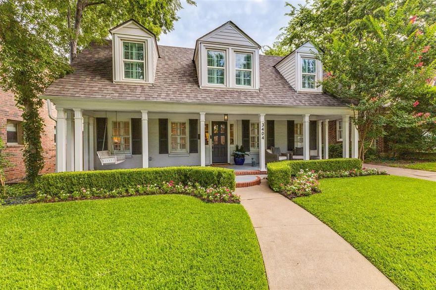 This exceptionally charming, impeccably maintained Park Cities cottage offers a tastefully updated open floor plan with delightful designer touches throughout.  A welcoming covered porch with a quaint seating area and porch swing sets the stage for the lovely setting one encounters upon entering this desirable home. The front living room adorned in natural light, seamlessly transitions to an elegant dining room, followed by a dreamy open kitchen.  This ultra spacious kitchen anchored by a large center island with white quartz counters, stainless appliances including a gas range, double ovens, a wine frig and abundant storage provides the ultimate gathering space for the home.   An adjacent mudroom accommodates a full size washer-dryer, locker and cubby space and a convenient half bath serving the back entry.  A second downstairs living area offers ideal space for a playroom, media room or study and is complete with an adjacent full bath.  The first floor primary suite is luxurious and extremely functional for a home of this scale.  Relax and indulge in a spa-like setting with a free-standing tub, large walk-in shower, dual vanities, designed in an elegant crisp white finish  A generous walk-in closet completes the owners retreat.  Upstairs houses two symmetrical front facing bedrooms with quaint valued ceilings along with a third bedroom which could easily serve as a nursery, playroom or office with a shared upstairs bathroom.  An easy low-maintenance turfed backyard includes a putting green providing for entertainment for all ages!  The front driveway has a privacy gate and offers direct access to the detached 2-car garage.  This move-in ready home offers convenient proximity to University Park Elementary, Holmes Aquatic Center (UP Pool), multiple neighborhood parks and walkability to Snider Plaza dining and shopping.  Hurry, this gem will not last long!