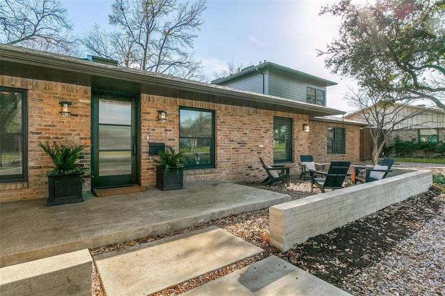 Located in the highly sought-after Private School Corridor, this beautifully updated 4-bedroom, 4-bath home offers space, flexibility, and exceptional drive-up appeal. Set on a lot with an expansive front yard, the property welcomes you with a charming fire pit gathering area. Inside, the downstairs features include two living areas, a gas fireplace, two separate offices, and a private primary suite with an ensuite bath and walk-in closet. The backyard is designed for entertaining with an oversized patio, second fireplace, and dining area. Added in 2022, the 910 sq ft upstairs includes two bedrooms, a large Jack-and-Jill bath, and a versatile flex space with extra storage. The attached carport offers two-car garage equivalent parking, three generous storage closets, a Tesla charger and wiring for a second. It was also thoughtfully designed to act as an additional entertainment space. The home is within walking distance of multiple playgrounds as well as Glen Cove Swim Club, a members-only community pool. It also offers quick access to Brookhaven College which is a neighborhood favorite when it comes to sledding each winter and fireworks viewing every July.