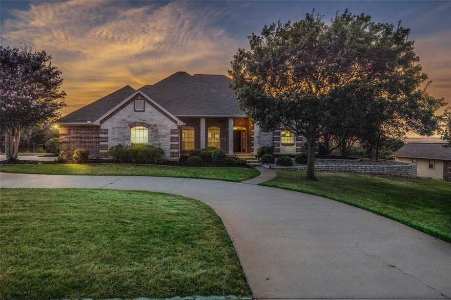 Incredible views with amazing sunsets!! Watch deer and turkey on the oversized back patio. Located on 2+ acres in a gated subdivision. NEW INTERIOR PAINT in the living, kitchen and dining areas, listing photos show old paint. The seller also painted the bathroom cabinets white for a fresh updated look. New water heater and garbage disposal installed 2026. The kitchen is a chefs dream with double ovens, island, and a butler's pantry. Laundry room has lots of counter space and room for a freezer. Great floorplan with split bedrooms and ultimate use of space. Primary bedroom has a sitting area, 2 walk in closets, separate double vanities, jetted tub, and walk in shower. The secondary bathroom is truly a jack and jill with separate vanities. 4th bedroom makes an excellent office located by the kitchen. Oversized 2 car garage and a separate detached 1 bay garage with electricity.  Country setting and conveniently located between Granbury and downtown Fort Worth.  Buyer and buyer agent to verify all information and measurements.
