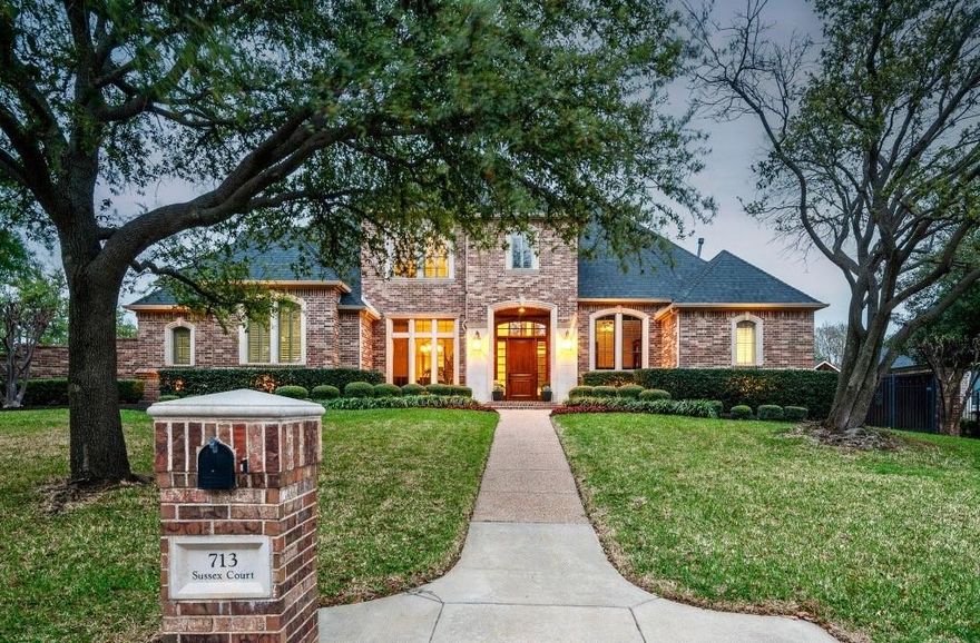 Gorgeous and immaculately maintained executive home in the highly sought-after neighborhood of Cambridge Place. Thoughtfully designed for the entertainer in mind, this one-of-a-kind custom home provides beautiful light-filled living spaces and one of the more impressive outdoor living experiences you’ll find. The stunning curb appeal will draw you in to find rich hardwoods, dramatic walls of windows, extensive millwork, and classic updates throughout. The bright and inviting kitchen is the heart of the home, opening seamlessly to the oversized family room with views of the lushly landscaped resort-like backyard. Step outside into the designated covered outdoor dining area that opens to an expansive outdoor living with vaulted ceiling, feature fireplace, built-in kitchen and bar, with plenty of space to host large gatherings in the comfort of a private backyard. Dive into the newly resurfaced sparkling pool with multiple water features, enjoy the large sodded area for play, or pull up a chair to roast marshmallows over the built-in fire-pit. The flexible 4 (optional 5) bedroom floor-plan offers primary suite and executive office down, with three spacious ensuite bedrooms and oversized great room with built in bar up. Who doesn’t love a secret room? Two bedrooms offer private access to an additional game room! Unwind in the comfort of your private primary suite with large updated bath with stand-alone tub, marble tile and graciously sized walk-in closet, or tackle a new hobby in the massive Laundry or impressive 4 car garage! Whether you love entertaining or are seeking a private estate to call home, nothing will compete with 713 Sussex, a luxurious retreat, right in the heart of Southlake; walking distance to Town Square, top rated Carroll schools and even Dragon Stadium! With easy access to highways and DFW airport but without the nuisance of road or air traffic noise, this home is perfect for the commuter looking for a peaceful place to unwind. Don't miss this one!