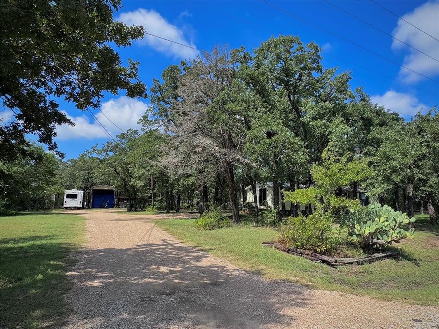 Check out this excellent opportunity to own 9.75 acres in the desirable Axtell, TX!! Countless opportunities await you here; whether you want to build your dream home, fix up the current homes, or look into other investment opportunities.  This property consists of an old farm home that is a 3 bed and 1 bath home.  There are also two mobile homes: the front yellow home is a 2 bed 2 bath home and the back mobile home is a 2 bed 1 bath home.  These homes are fixer uppers that will need your tender, loving, care if they were to stay.  The front 4 to 5 acres are wooded with several cleared paths to get through the property.  The back 4 to 5 acres open up into a pasture where the sunsets never get old.  The property consists of a large tank or pond for your enjoyment and entertainment.  The property currently has 3 water meters and 4 electrical poles.  The yellow mobile home is on a month to month lease.  Approximately 13 miles from downtown Waco and all that the city offers.  RV cover to not convey, but can be negotiated.