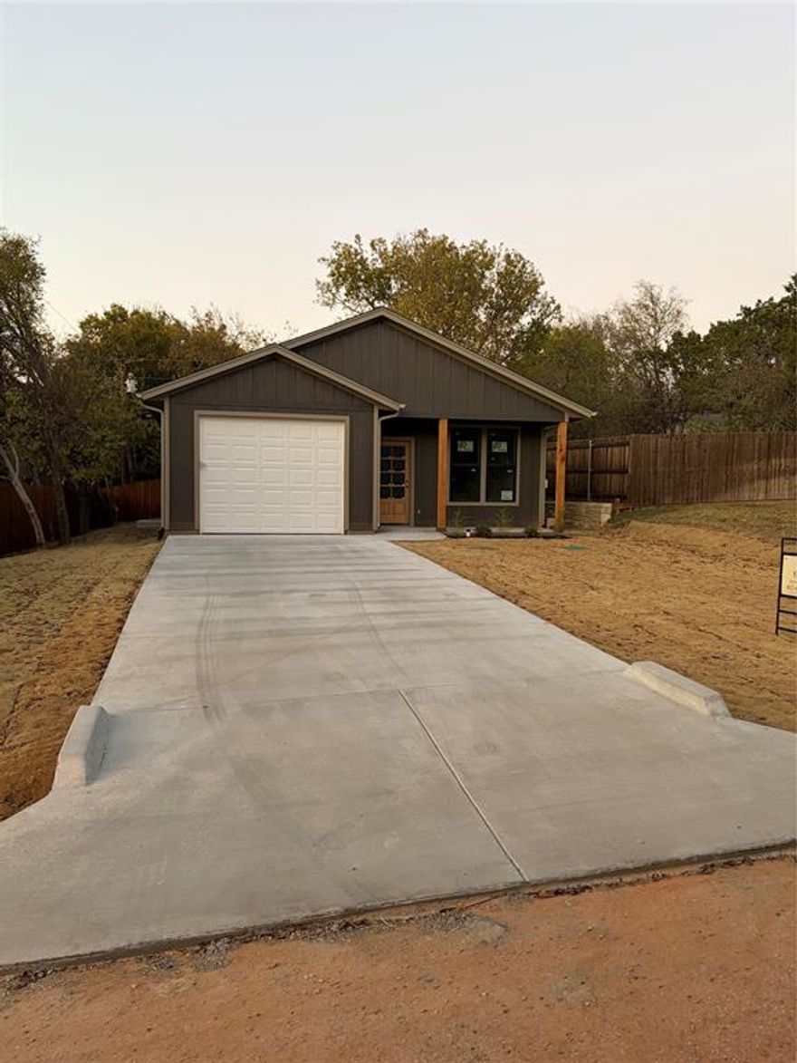 Welcome to this stunning 3-bedroom, 2-bathroom home offering 1,292 square feet of thoughtfully designed living space in the heart of Western Hills Harbor. Located on the Fort Worth side of Granbury, this property combines small-town charm with convenient access to major highways, shopping, dining, and Lake Granbury—perfect for both full-time living, a weekend retreat, or even a short-term rental investment. Step inside to discover an open-concept floor plan filled with natural light and modern finishes. The spacious living area flows seamlessly into the dining and kitchen spaces, creating an ideal layout for entertaining or relaxing with family. The kitchen features brand-new stainless steel appliances, custom cabinetry, sleek countertops, and a large island that doubles as a breakfast bar. The primary suite offers a private retreat, featuring a walk-in closet and a spa-inspired en-suite bathroom with dual sinks, a beautiful walk-in shower, and modern fixtures. Two additional bedrooms are generously sized and share a well-appointed full bathroom—perfect for guests, children, or a home office. Built with energy-efficient materials and systems, this home offers comfort, quality, and long-term savings. Outside, enjoy the covered patio for morning coffee or evening gatherings, and the spacious yard provides plenty of room to personalize—whether that’s adding a garden, firepit, or fence for pets. Residents of Western Hills Harbor enjoy a peaceful neighborhood atmosphere with Lake Granbury access, while still being just a short drive from Fort Worth. With short-term rentals permitted, this property also offers excellent income potential for investors or those looking for a dual-purpose home. Don’t miss this opportunity to own a brand-new home in one of Granbury’s most desirable and commuter-friendly areas. Schedule your showing today and experience everything this beautiful home has to offer!