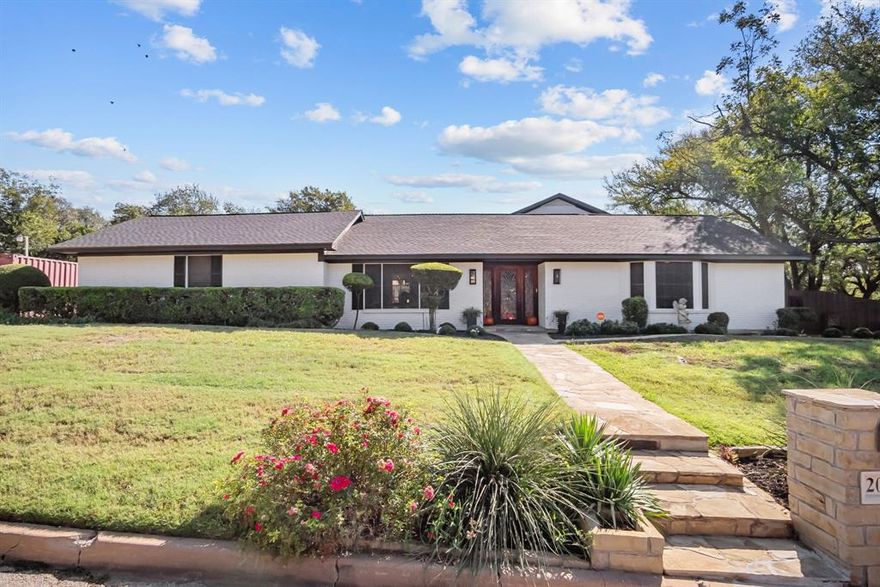 Meticulously maintained 4 bedroom 3 and a half bath located on historic 4th Avenue convenient to shopping, restaurants in downtown Mineral Wells.  Gracious layout providing large bedrooms and distinct multilevel areas for entertaining friends and family.  Kitchen invites culinary creativity and family gatherings with classic white cabinetry and spacious counters with custom crafted built-in providing ample storage and display area, double oven with warmer, Subzero refrigerator freezer.  Adjoining the kitchen is a bright and sunny breakfast room overlooking the rock patio outdoor entertainment area. The spacious formal living room and elegant dining room add sophistication complementing the downstairs den area with TV and fireplace, which has French doors that open onto the patio for outdoor entertaining.  Amazing utility room has large sink and ample space for crafts and sewing.  Enjoy year-round gardening in the greenhouse nestled in the backyard.  New roof in addition to many other updates.  Don't miss this classic beauty.