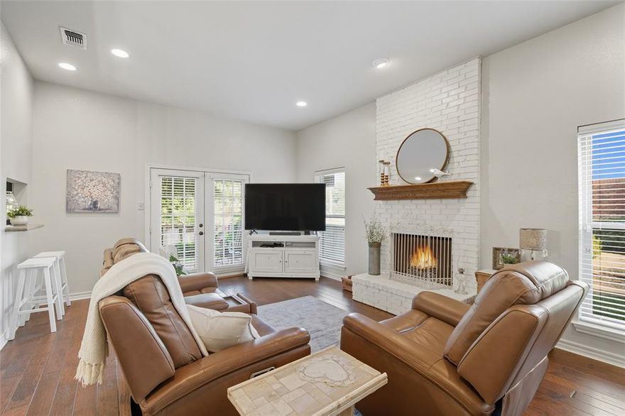 Back on market, their loss, your gain!  Rare find, carefree living! Welcome to this beautiful condo offering the perfect blend of comfort and style. Step into the lush backyard with vibrant flower beds, rich green grass, and a covered patio—an inviting retreat for relaxing or entertaining.
Inside, the spacious open floor plan features a stunning kitchen with granite countertops, crisp white cabinets, and stainless steel appliances. The kitchen flows seamlessly into the large family room, highlighted by a charming white brick fireplace with electric insert. A convenient half bath and gleaming hardwood floors complete the main living space.
Upstairs, the oversized primary suite is a true retreat with a nice closet plus 3 closets in the hallway, dual sinks, granite countertops, a large walk-in shower. and a nice balcony with double doors.  A second  bedroom and full bath provide additional comfort for guests.
Storage is abundant throughout, with a large walk-in closet on the first floor, plus a two-car garage offering additional space. Washer, dryer, and refrigerator convey with the property. Electric runs $80-$150 per month and water about $50 per month. The condo HOA fees cover all exterior maintenance, roof, foundation, yard maintenance…mowing front and back yard, sprinkler system, hedge trimming, and water for the sprinkler system.  
This home combines elegance, functionality, and thoughtful details—making it an ideal place to call home. Just a couple of blocks from Lake Arlington, nice parks, and the Activ.