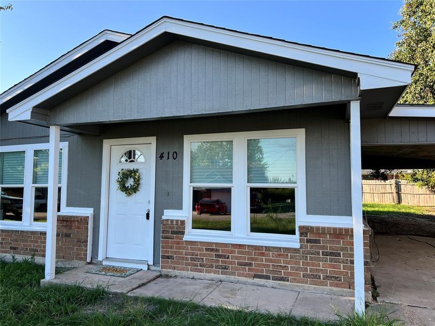 ***Full YouTube Video Tour Available -- Search for Property Address***Rockwall-Heath Highschool*** Charm galore, this home is situated right across the street from Rockwall Lake! Great access to Dining, Restaurants, good retail. Surprisingly spacious for the square footage! Large Living area with great wall space.  Good natural light in this open floorplan. Attractive laminate wood flooring throughout, no carpet here! Handsome 6 inch baseboards. Freshly painted in & out. Spacious bath with linen cabinet and quartz countertop with bronze faucet and undermount sink. Kitchen also features quartz countertops, abundant counterspace and cabinetry. Undermount sink with commercial style bronze faucet. Dishwasher & range will be included! Large Primary Bedroom with good wall space, enough for a six drawer dresser and a club chair. Upgraded vinyl windows at front and in two bedrooms. Great privacy in the back yard, a great find in a good city!