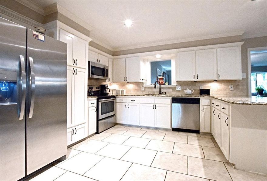 REDUCED!!!  Beautiful hardwood floors. Granite in the kitchen and both baths. 25 year Architectural shingle roof replaced in July 2025. Water heater replaced in 2025. Low-E double pane windows replaced in 2016.  Insulated garage doors replaced in 2015.  Bring your own personal style to make this your very own. Just around the corner from Bayles Elementary, this lovely home has all the room you are looking for with two large living spaces and a spacious kitchen that opens to an oversized dining area. The layout is perfect for entertaining! Primary bath has granite countertops and a large walk-in shower. Create your own She-Shed or Man Cave in the backyard storage shed. Enjoy time in the oversized backyard with a thick lush lawn, mature trees, 8-foot high, wooden privacy fence and a covered back patio. Fire up that grill and call the neighbors! You are going to love living here.