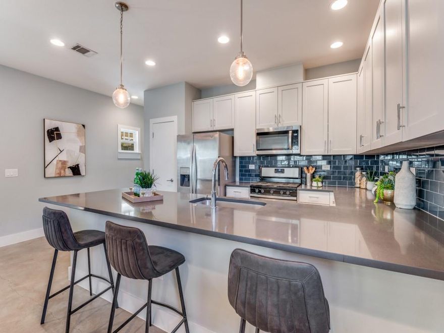 OAK CLIFF AT ITS BEST — Located in the charming Kings Highway Conservation District, this home features an open-concept layout with spacious living and dining areas, sleek stained concrete floors, and a chef’s kitchen complete with a 5-burner gas stove, stainless steel appliances, and a large island ideal for entertaining—refrigerator included. A flexible downstairs front bedroom offers the perfect space for a home office, playroom, or creative studio.

Beautifully maintained, this home is move-in ready with plantation shutters, paid-in-full solar panels, a tankless water heater, new HVAC, water-saving fixtures, spray-foam insulation, and a whole-home surge protector. Fresh interior paint and HOA-maintained front and back lawn care make this home a dream to own.

Upstairs, the bright primary suite includes a generous bath, accompanied by two additional light-filled bedrooms and a full hall bath. The conveniently located laundry room comes with a washer and dryer., low-maintenance living in this turnkey, energy-efficient home just minutes from downtown Dallas. 

Enjoy walkable urban convenience with neighborhood dining, shopping, scenic trails, tennis courts, Kidd Springs Recreation Center, and Stevens Park Golf Course all close by. Rosemont School is a quick five-minute stroll, and Twelve Hills Nature Center sits at the end of the street, offering a peaceful retreat and a true sense of community. The vibrant Bishop Arts District adds even more restaurants, boutiques, and cultural experiences right at your fingertips.

 Buyers may contact the City of Dallas for additional district information.