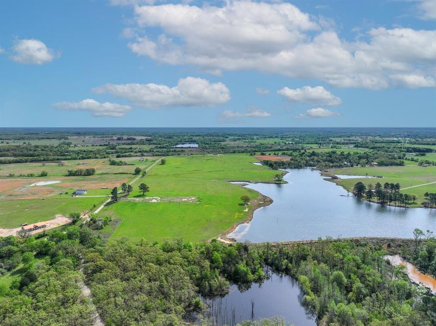Stunning waterfront acreage in one of the county’s most beautiful new rural developments. Tract 2 features 15.44 acres directly on a fully stocked private lake, perfect for fishing, canoeing, or paddle boarding. A pipe gate entrance is already in place, and utilities are confirmed with Wood County Electric and Pruitt Sandflat Water. Open pastureland with hay production and ag exemption in place makes this a practical and beautiful spot for your dream home, ranch, or weekend retreat.