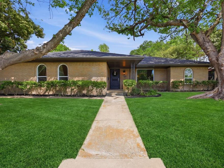 Thoughtfully reimagined and rich in character, this 2,228 SF home blends timeless charm with modern ease. Offering 4 bedrooms and 2.5 baths—including a Jack and Jill—the home unfolds with a graceful, livable flow. Sunlight pours through picture windows, dancing across gorgeous wood floors and illuminating spaces designed for both comfort and connection. The living room, anchored by a custom ceiling and inviting fireplace hearth, serves as the heart of the home. A fully renovated kitchen showcases classic styling with new appliances, custom cabinetry, and fixtures—equally suited for quiet mornings or lively gatherings. Custom built-in cabinetry found throughout the home adds both elegance and thoughtful functionality. Comprehensive updates, including new windows, roof, lighting and flooring provide comfort and beauty throughout. Complete with a private backyard and rear-entry two-car garage, this is a home that invites you to linger—and stay!