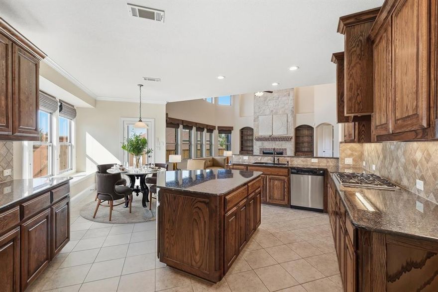 Experience luxury and space in this stunning Bud Bartley-built home! Boasting 4,264 sq. ft. on a desirable corner lot. This two-story gem features 4 bedrooms, 3.5 baths, a study with glass French doors, a bonus room, media room, and an additional upstairs living area. The chef’s kitchen offers granite countertops, stainless steel appliances, a gas cooktop, center island, butler’s pantry with wine fridge, a brand-new microwave, double ovens, and breakfast area perfect for entertaining. Relax by the stone gas fireplace in the open living area with hand scraped wood floors, soaring ceilings and abundant natural light. The primary downstairs suite includes an adjacent bonus room perfect for a nursery, office, or home gym. The outside garage door is freshly painted, and the inside is finished out with an epoxy floor. Enjoy the spacious backyard, walking and biking trails, nearby playgrounds, and fishing ponds. Conveniently located minutes from Lewisville Lake, restaurants, and The Shops at Highland Village, this home truly has it all! Roof replaced 2017, new fence Aug. 2022, new upstairs HVAC Oct. 2022, new downstairs furnace October 2024.