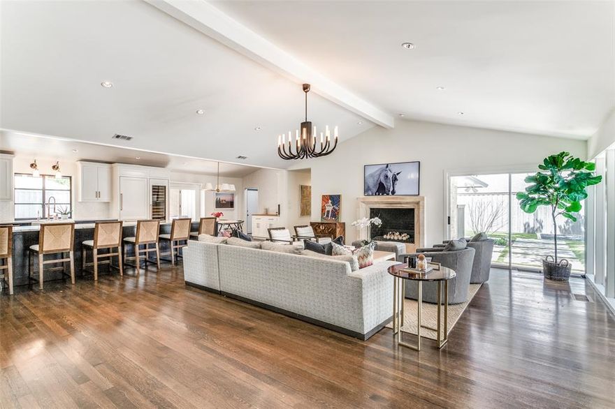 Sleek, sophisticated and exceptionally updated Russwood Acres home on over half an acre! Magnificent light filled spaces, vaulted ceilings, multiple living areas and designer fixtures and finishes throughout. Stunning culinary center features a Wolf range, SubZero refrigerator, wine refrigeration and custom cabinetry. Four sizable bedrooms and incredibly stylish updated baths with thoughtful details. Ideal floor plan with flexible spaces for an office, playroom or gym. Marvelous outdoor spaces includes a sparkling pool, putting green, relaxing sitting areas and firepit. Attached 3 car garage and gated driveway. Truly one of the most extraordinary homes in one of the most desirable neighborhoods convenient to shopping, major highways, both airports and private schools.