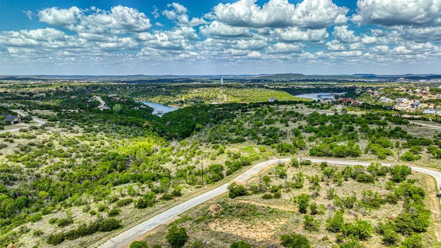 WATER VIEW LOT IN THE CLIFFS RESORT ON POSSUM KINGDOM LAKE. Build your dream home on this stunning water view lot. The Cliffs Resort is a highly sought after location at Possum Kingdom lake! This beautiful property offers the perfect blend of lake views and peaceful resort living. Enjoy all the amenities this premier community has to offer. Amenities include 36 complimentary rounds of golf per year on the championship course, two swimming pools, marina access, restaurant, hotel, tennis courts, and 24 hour security. This location is ideal for a relaxing getaway or full time living. Whether you're looking to build now or invest for the future, this lot offers both beauty and value on Texas's best lake. Don't miss your chance to own a piece of paradise at The Cliffs Resort on Possum Kingdom lake! All information in listing deemed reliable but not guaranteed. It is up to the buyer and buyer's agent to verify.