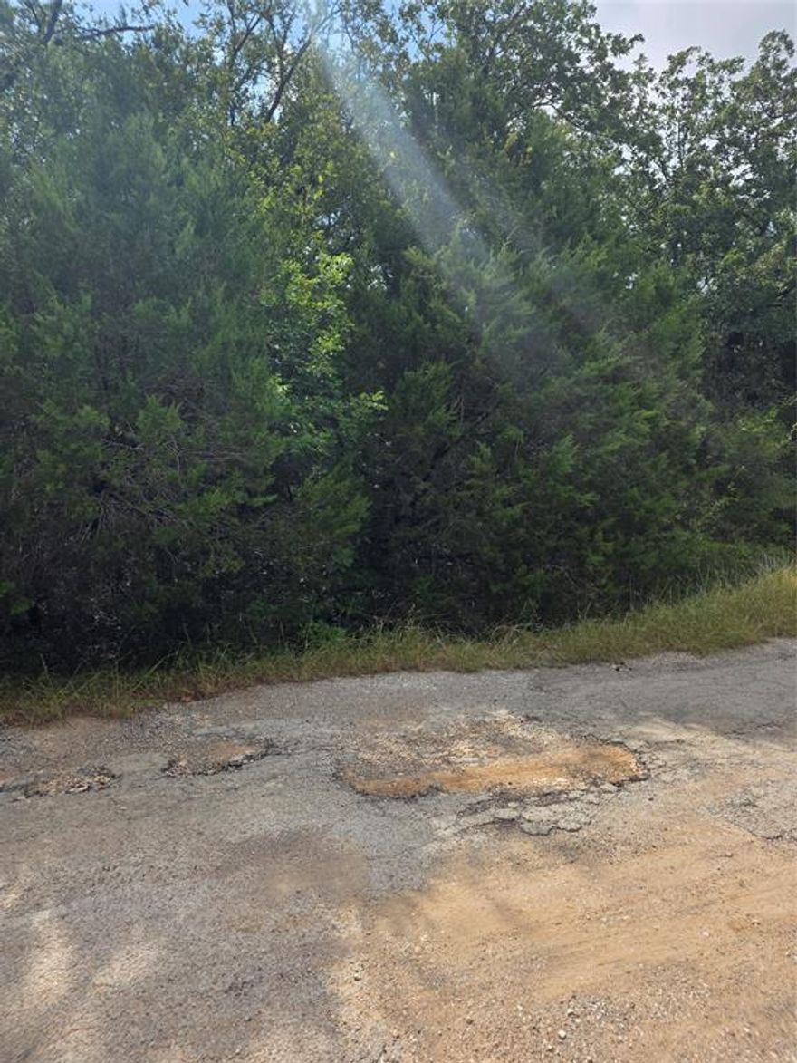 Great interior lot with good adjacent neighbors. Quiet residential community just off Tin Top Hwy between Hood County and Parker County.
If you like quiet, cedar wood, quick access to major thoroughfares, you want this lot! Just a couple of blocks off Tin Top Highway, but worlds away from the hustle and bustle of Granbury and Weatherford! Come see.