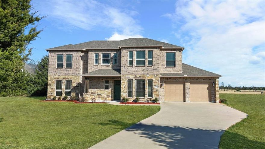 Rare opportunity to own a Scott Clements custom home on approximately 2 private acres with NO HOA, located minutes from Rockwall and Lake Ray Hubbard with convenient access to the Dallas–Fort Worth metroplex.

This functional floor plan offers 4 bedrooms and 4 full bathrooms with ideal separation of living spaces. The main level features a formal dining room and an open-concept living area with fireplace that flows into the gourmet kitchen. The kitchen includes a large island, walk-in pantry, extensive custom cabinetry, and appliances including refrigerator, cooktop, oven, microwave, and dishwasher.

Downstairs includes two bedrooms and two full bathrooms, ideal for guests or multigenerational living.

Upstairs serves as a private retreat featuring the primary bedroom with en-suite bathroom, complete with dual vanities, jetted soaking tub, separate walk-in shower, and large walk-in closets. Also upstairs are an additional bedroom and bath, a dedicated office, and a spacious family room or media-game room providing a second living area.

The home has been professionally staged to provide a neutral canvas for buyers to personalize.

Outdoor living includes a covered patio with built-in fireplace, a fishing pond, workshop with electricity, and a chicken coop and dog house with water.

A separate structure on the property is approximately 1,200 square feet designed as a 2-bedroom residence with a kitchen. The building is unfinished and ready for completion. Not included in the primary home’s square footage, it offers potential for guest quarters, multigenerational living, studio, or office use.

Located in a highly rated school district with a new high school scheduled to open August 2026. Enjoy peaceful country living approximately 35 minutes from Downtown Dallas and close to Rockwall dining, shopping, boating, and recreation at Lake Ray Hubbard.

Schedule your private showing today.