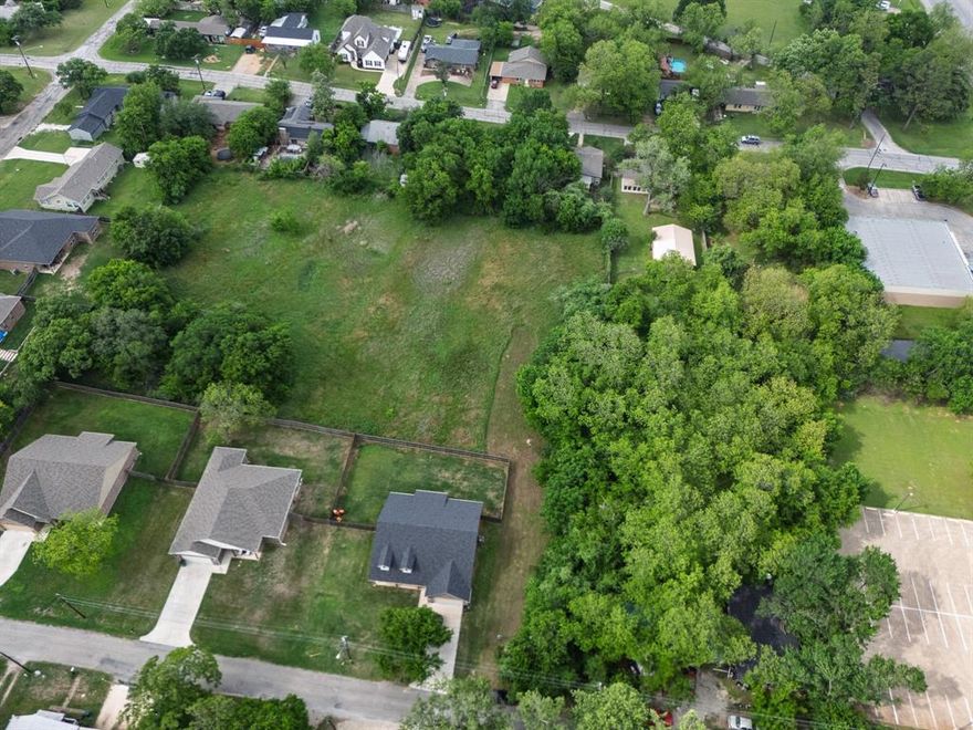 2.1-acre residential development site within Joshua city limits with utilities available and flexible build options. Zoned R1, the property could support eight 10,000 sqft, offering a straightforward approach for builders seeking a clean entry into an active growth corridor. The site also presents a higher-density opportunity, with prior discussions held with the city regarding a townhome concept, allowing a future buyer to explore a planned development or variance for increased potential. Approximately 25 minutes from Fort Worth, the property benefits from convenient access to Chisholm Trail Parkway and Interstate 35W, supporting commuter connectivity across the south Fort Worth and Burleson markets. Ongoing residential expansion and retail growth throughout the surrounding area continue to drive demand for new housing options within this corridor.
Water, sewer, and electric service are available, reducing upfront infrastructure considerations and supporting a more efficient development timeline. The site layout and size allow for multiple design approaches depending on end use, whether single-family construction or a higher-density configuration subject to city approvals. This is a development-ready opportunity with defined pathways in a location experiencing steady growth and increasing demand.