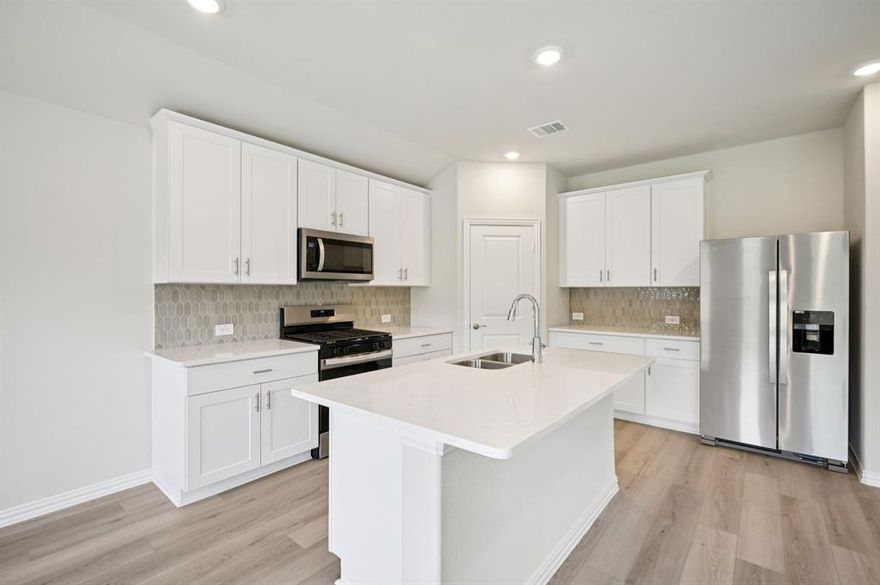 BRAND NEW energy - efficient home Mar 2026! Fix dinner at the Greenville's sprawling kitchen island without missing any of the action in the family room. White cabinets with veined white quartz countertops, muted beige EVP flooring with light taupe carpet. Small-town charm meets modern convenience in Sherman, located 40 miles north of the Dallas metroplex and recognized as one of the best small cities to live in. Westmoor residents will enjoy playgrounds, trail access, and a scenic greenbelt. Groundbreaking energy efficiency is also built seamlessly into every home in this community so you can spend less on utility bills and more on the things that matter most. Each of our homes is built with innovative, energy-efficient features designed to help you enjoy more savings, better health, real comfort and peace of mind.