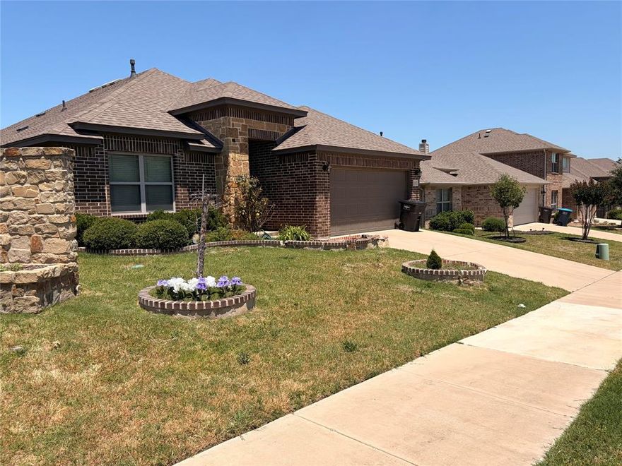Welcome home to this beautifully maintained, move-in ready 4-bedroom, 2-bathroom corner lot home offering the perfect combination of comfort, style, and functionality. From the moment you arrive, you’ll appreciate the inviting curb appeal, spacious layout, and features designed for both relaxing and entertaining. With no rear neighbors, you can enjoy added privacy while creating memories with family and friends in the oversized backyard complete with a covered patio and grilling area—perfect for BBQs, gatherings, pets, and outdoor fun year-round.

Step inside to discover an open-concept floor plan filled with natural light and designed with modern living in mind. The spacious family room features a cozy fireplace, creating the ideal setting for movie nights, holidays, or quiet evenings at home. The kitchen is truly the heart of the home, showcasing a large center island perfect for meal prep, serving guests, casual dining, or morning coffee. The open flow between the kitchen, dining, and living areas makes entertaining effortless.

The private owner’s suite offers a relaxing retreat with a garden tub, separate shower, dual functionality, and a spacious walk-in closet. The additional bedrooms provide flexibility for family, guests, a home office, or workout space. This home delivers the aesthetics buyers are searching for without the added expense or stress of updates—simply move in and enjoy.

Even better, the washer, dryer, and stove will remain with the property, adding extra value and convenience for the next homeowner. Conveniently located near major freeways, shopping centers, restaurants, grocery stores, schools, and entertainment, this property provides quick access to Downtown Fort Worth and Sundance Square while still offering the comfort of suburban living.

MUST SEE 

Buyer and buyer’s agent to verify all information including taxes, schools, lot size, square footage, and room dimensions.