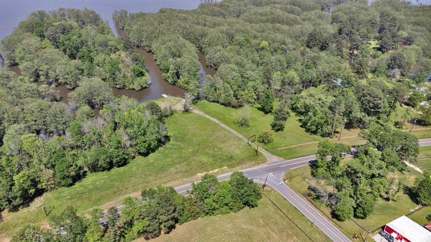 Cypress Alley – A Rare Opportunity on Cross Lake

Discover over 3 acres of waterfront potential with Cypress Alley, boasting approximately 1,100 feet of lake frontage on scenic Cross Lake. Nestled at the end of Jolly Napier Road on South Lakeshore Drive, this property holds deep roots in local history—originally established in 1938 as Loyd’s Landing, one of the area’s earliest marinas.

While all original structures have been removed, the land is ready for redevelopment. Improvements include a rebuilt seawall, a concrete boat launch, and a deepened harbor for year-round access.  A brand-new fence stretches along the right side of the property, while a handcrafted Cypress Alley entry gate adds both charm and distinction to the entrance. With its iconic cypress tree-lined inlet, this land offers endless possibilities—whether you're envisioning a private estate, boutique marina, or lakefront business venture.

A rare chance to own a piece of Cross Lake history —Cypress Alley is ready for its next chapter.

Approximately 3.2 acres are deeded and approximately 5 acres are usable to the new owner.  Minerals will be transferred and are producing.